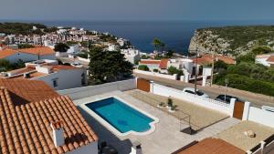 a view of a villa with a swimming pool at Villa Vistamar - Piscina privada, vistas al mar y a 5 min de la playa in Cala en Porter