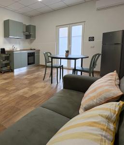 a living room with a couch and a table at Il Canto Quinto in Acquaviva delle Fonti