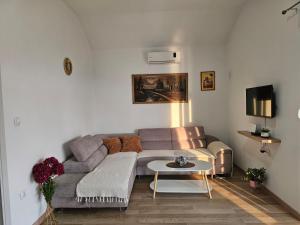 a living room with a couch and a table at Vila Lana in Trebinje