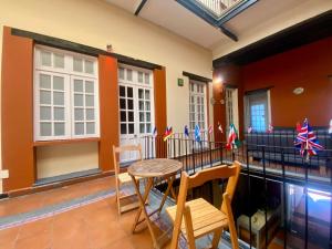 a living room with a table and chairs at Casa Regina CDMX in Mexico City