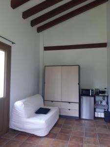 a living room with a white couch in a room at Eguzkitze Habitacion Rural Independiente in Abaltzisketa +29 photos