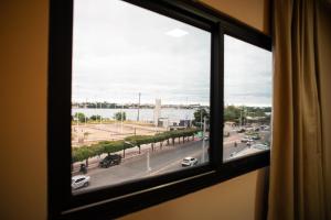 a window with a view of a street at Petrolina Palace Hotel in Petrolina
