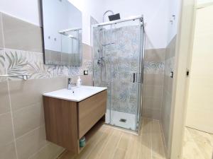 a bathroom with a shower and a sink at Casa vacanze Poma in Custonaci +21 photos