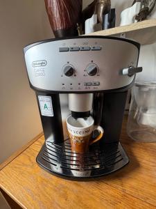 a coffee maker sitting on top of a table at Dom nad rzeką in Neple