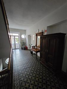 a living room with a table and a wooden cabinet at Apartma 2 in Pekre