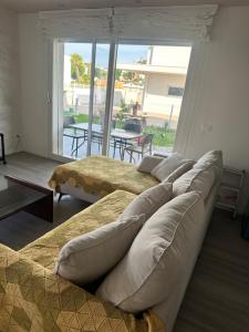 a row of beds in a room with a patio at jesolo wellness house in Lido di Jesolo