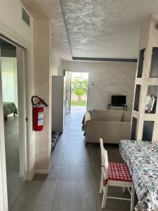a living room with a bed and a couch at jesolo wellness house in Lido di Jesolo