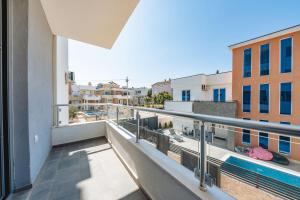 a balcony with a view of a pool and buildings at Malik Bay RESIDENTS in Bar