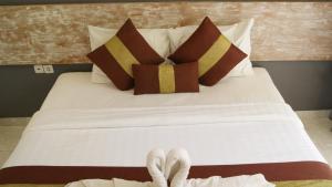En eller flere senge i et værelse på Sugiras Living