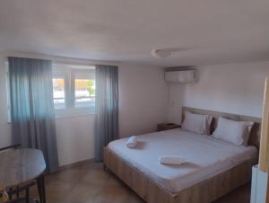 a bedroom with a bed and a window at Vila Bolonja in Struga +45 photos