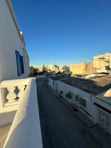 a view of a city from a balcony at Appartement henda 04 in Sousse