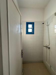 a bathroom with a shower and a window at Appartement henda 04 in Sousse +7 photos