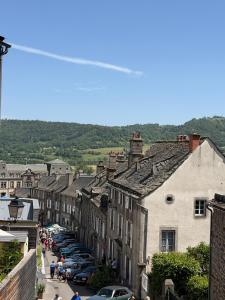 a town with cars parked on a street at Murat - Le Duplex By Murat in Murat