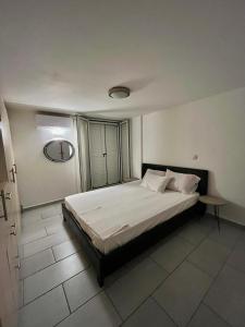 a bedroom with a large bed in a room at Vouzianas home in Kefallonia