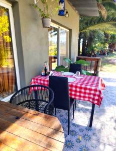 a table with a red and white checkered table cloth at La Elegida Villars in General Las Heras