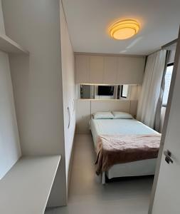 a bedroom with a bed in a small room at Itapema in Itapema