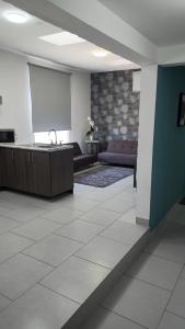 a meeting room with a podium and a screen at Suites André Confort Ejecutivo in Aguascalientes