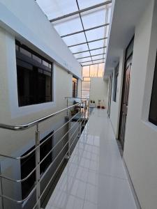 a hallway in a building with a skylight at Hostal Amazonas in Chivay