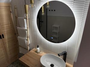 a bathroom with a white sink and a mirror at Apartamento Casa Nela 3 in Medellín +12 photos