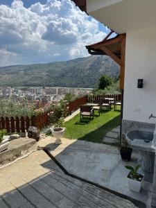 a patio with a view of a city at Guest House Mario in Berat +20 photos