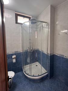 a bathroom with a shower with a glass door at Villa Bella Sozopol in Sozopol +19 photos