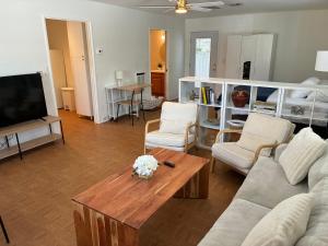a living room with a couch and a coffee table at Quail's Nest - Downtown Studio in Tucson