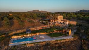 an aerial view of a house with a swimming pool at Barkala Mula in Artá