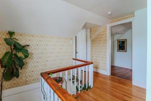a staircase in a home with a stair case at The Mariposa in Staunton