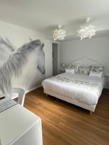 a white horse sticking its head into a bedroom at Chez Patou in Laval