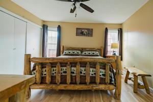 a bedroom with a large wooden bed in a room at Heavenly View - Bear Themed Cabin, HotTub, Dog-Friendly, Near Gatlinburg in Gatlinburg