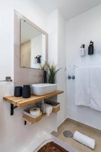 a bathroom with a sink and a mirror at Studio with Terrace & Stunning Views in Güéjar-Sierra +28 photos