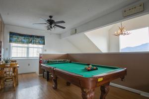 a living room with a pool table in it at Heavenly View - Bear Themed Cabin, HotTub, Dog-Friendly, Near Gatlinburg in Gatlinburg