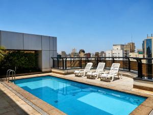 a swimming pool on the roof of a building at TFL EXECUTiVE PREMIUM FARIA LIMA - ITAIM in São Paulo