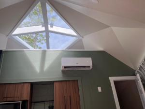 a ceiling with a window and a air conditioner in a room at Blue Bayou Dome Village in Dingwall