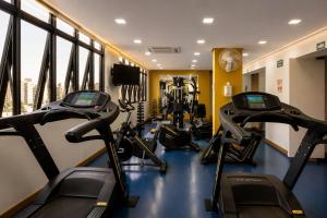 a gym with several treadmills and cardio machines at TFL EXECUTiVE PREMIUM FARIA LIMA - ITAIM in São Paulo