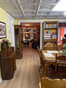 a living room with a table and a dining room at Buffalo Guesthouse in Buffalo