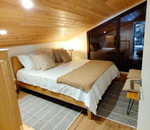 a bedroom with a bed in a small room at Puro Wild in Geres +120 photos