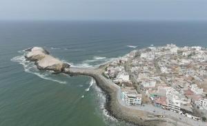 an aerial view of a beach with buildings and the ocean at Punta Hermosa Apartment in Punta Hermosa