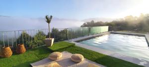 a swimming pool on the side of a house at Puro Wild in Geres