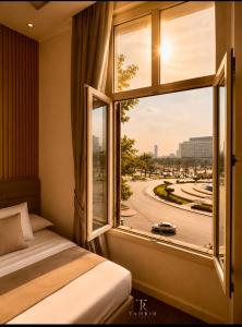 a bedroom with a window with a view of a street at Lumina View Hotel by Tahrir - Downtown in Cairo