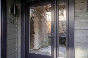 a door with a window with a curtain on it at Designer Lakefront Condo C1 Wapato Point Chelan in Manson +34 photos