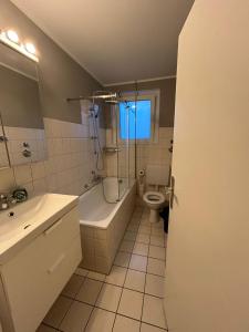 a bathroom with a sink and a toilet and a shower at Monteurs Freund in Lotte