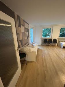 a room with a bed and chairs in it at Monteurs Freund in Lotte +12 photos