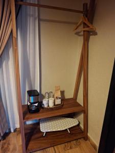 a wooden shelf with a coffee maker on it at Finca La Concepción in Marcala