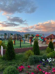 a park with a playground with at РадугаВест58а in Koshkolʼ