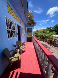 a red carpet on a balcony of a building at Casa Dreamy in Zihuatanejo
