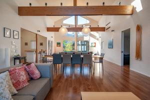 a living room with a couch and a table at The Orchards Niseko in Kutchan