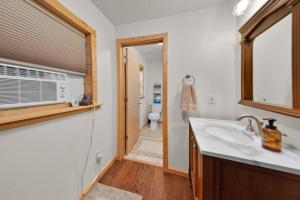 a bathroom with a sink and a toilet at Moose Hollow Studio Cabin in Eureka +8 photos