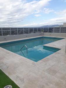 a swimming pool on the roof of a building at Luxury in Villa Carlos Paz