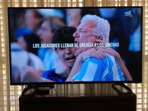 a television screen with a soccer game on it at Casa Hanami, habitación doble excelente ubicación in Salta